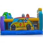 Colorful inflatable obstacle course featuring a yellow car with a lifebuoy and lifeguard sign, set against a beach-themed backdrop—perfect for NY events or bounce house Long Island party rentals, with vibrant blue, purple, green, and yellow sections.