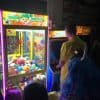 Guy playing donkey kong at arcade