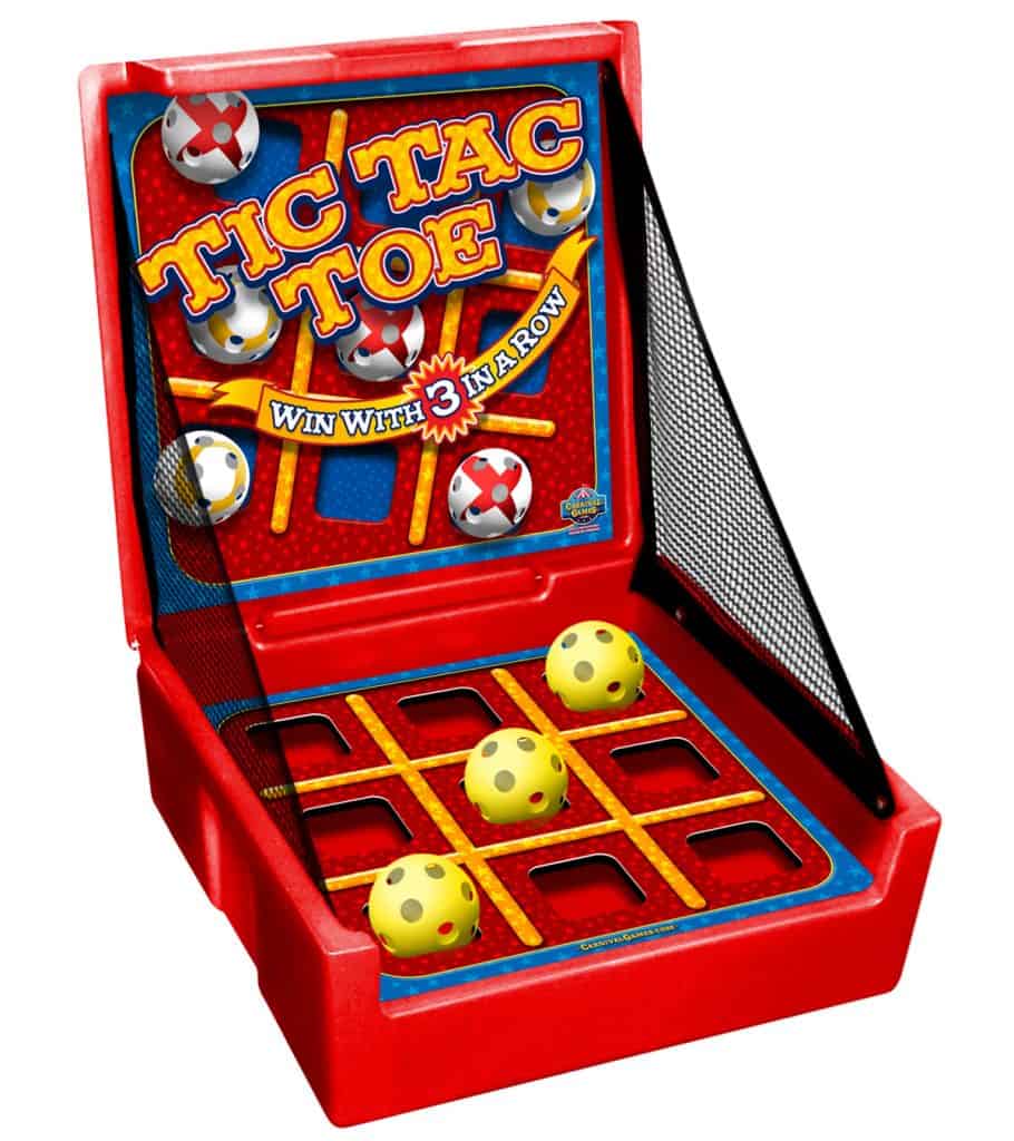 A tabletop Tic Tac Toe game with a red plastic base, vertical board labeled “Tic Tac Toe,” three yellow balls featuring red and gray dots, and a black net—perfect for party rentals Long Island or NY events.