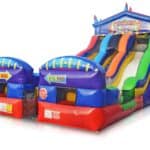 This colorful inflatable slide and bounce house Long Island combo features multiple lanes, stars, and a “Fun Slide” sign—perfect for party rentals Long Island, NY. Bright red, blue, green, and yellow with entry points on the left.