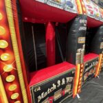 Inflatable carnival game booth with slot machine graphics, bright gold lights, and bold "Match 3 & Win" text—perfect for party rentals Long Island or bounce house Long Island events. Try your luck and GO FOR THE JACKPOT!.