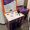 Two colorful arcade-style machines with Mercury branding, labeled with holes titled “Capital Raising,” “Global Reach,” and “Market Volatility.” Text reads, “It’s more than a bank account. It’s taking the leap on your business.”.