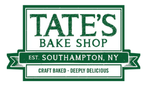 Logo for Tate’s Bake Shop with green and white text reading: “Tate’s Bake Shop. Est. Southampton, NY. Craft Baked – Deeply Delicious.”.