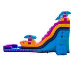A colorful inflatable water slide with palm tree decorations, featuring a tall slide that curves down into a splash pool at the bottom. The slide has vibrant blue, orange, yellow, and pink sections.