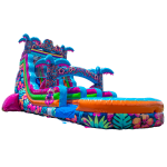 A colorful inflatable water slide with tropical and floral patterns features palm tree decorations, a tall slide, and a splash pool at the bottom.