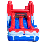A large inflatable slide with red, blue, and white colors. The slide features two tall red towers on each side, blue and white patterned sides, and a blue sliding surface in the center.